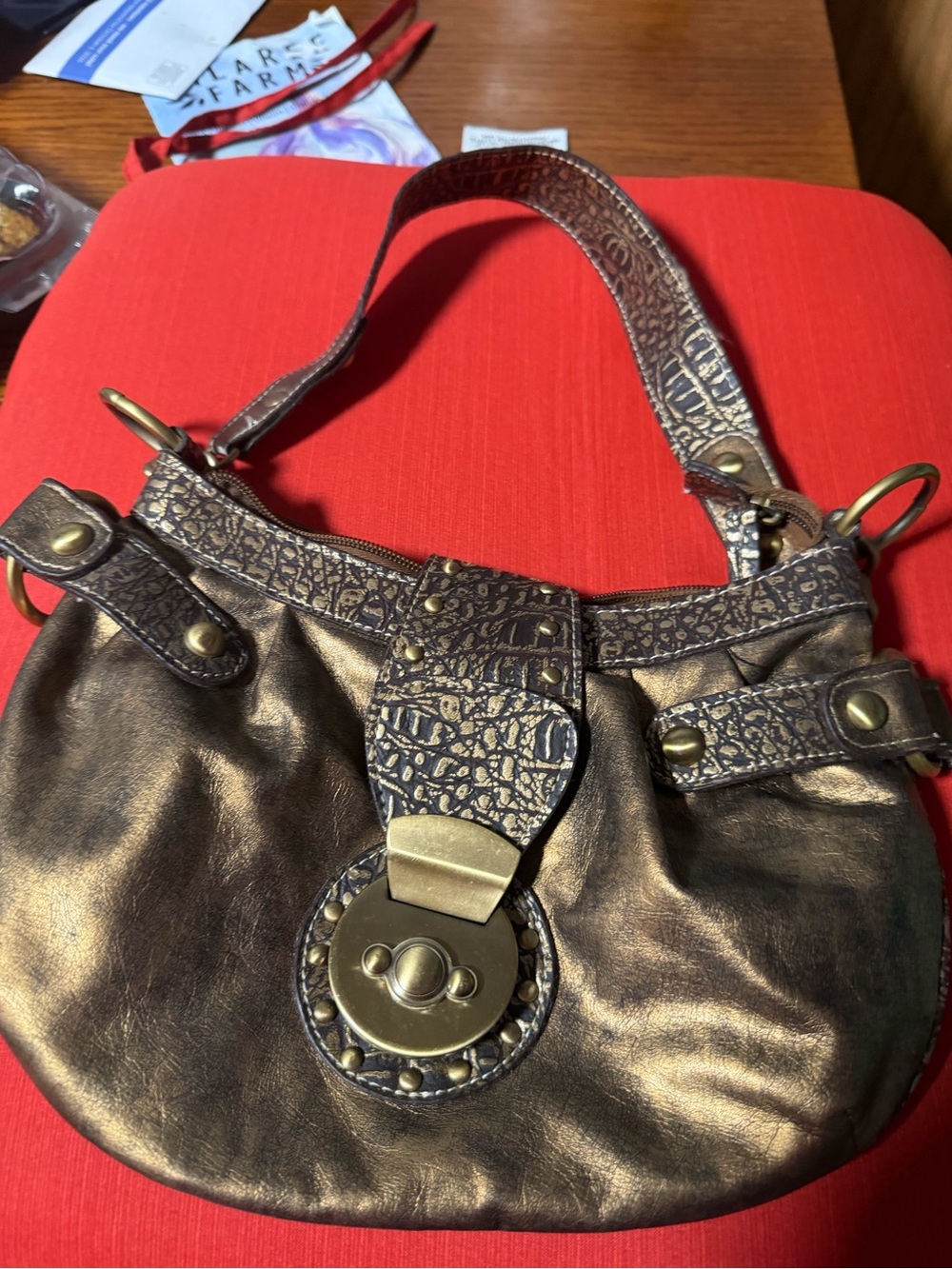 Metallic Bronze Shoulder Bag with Textured Strap and Turn-Lock Accent